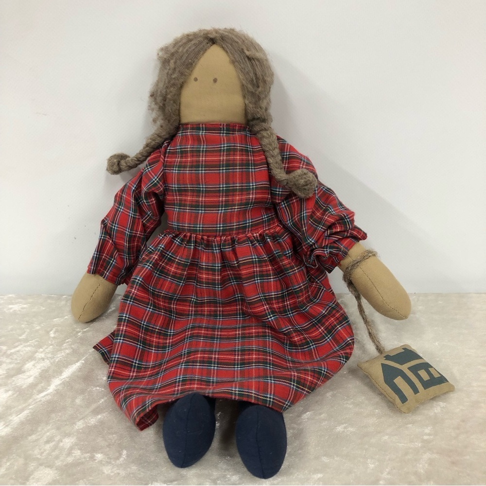 Vintage handmade rag doll holding a pillow type purse